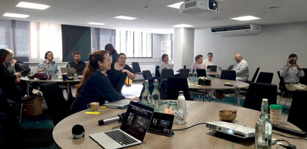 group of participants listening to a speaker