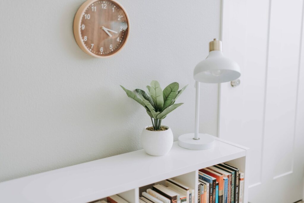 a desk with a clock over it