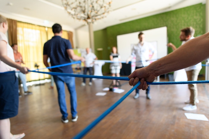 Photograph of participants playing a training game.